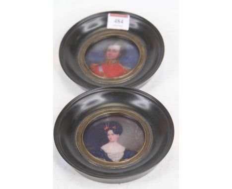 A pair of reproduction portrait miniature prints, each housed within an ebonised frame, dia. 14.5cm