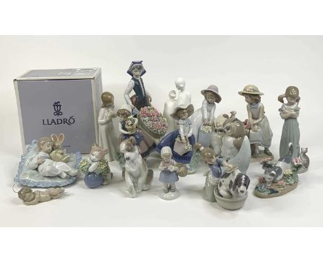 A collection of sixteen Lladro, Nao and Royal Doulton porcelain figures, largest height 26cmGirl washing dog – missing an arm