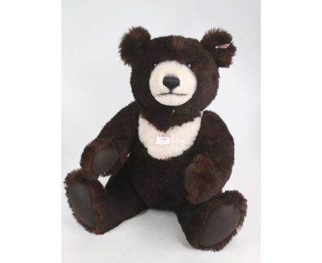 A large Steiff teddy bear, having opposable limbs, seated h.49cm