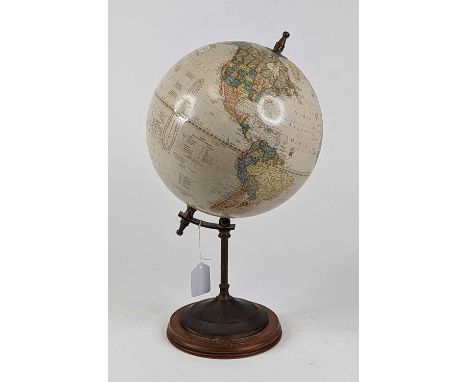 *A reproduction terrestrial table globe, on brass support, and further circular wooden base, height 41cm