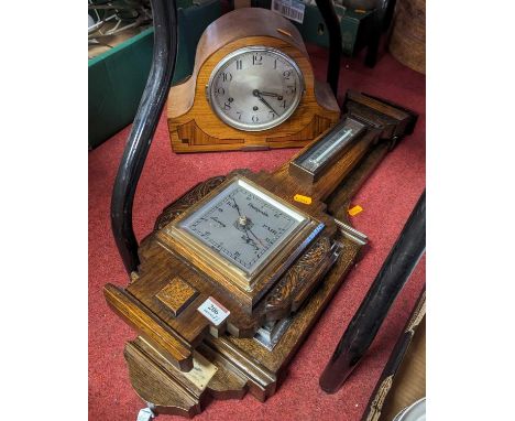 An Art Deco walnut cased geometric inlaid mantel clock, the silver painted dial with Arabic numerals, having Westminster chim