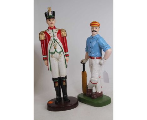 A modern painted cast iron model of a solider height 40cm, together with another similar of a cricketer