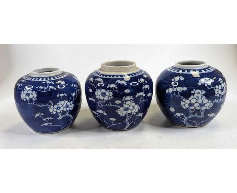 A Chinese porcelain ginger jar, decorated in the blue and white prunus pattern, h.11.5cm; together with two others (lacking l
