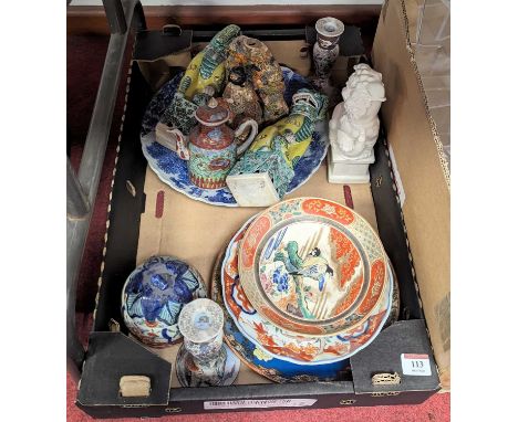 *A collection of oriental ceramics to include Japanese Imari porcelain dishes, Chinese models of temple dogs etc
