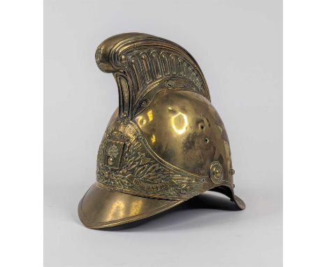 A 19th century brass fireman's helmet, height 25cm