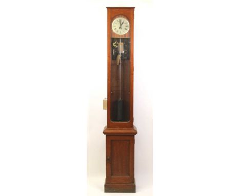 A teak cased Synchronome electric Master clock, having a signed silvered Roman dial, the glazed case enclosing one second pen