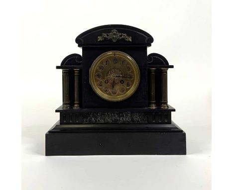A Victorian black slate mantel clock, of architectural form,the brass dial showing Arabic numerals, having an 8 day movement,