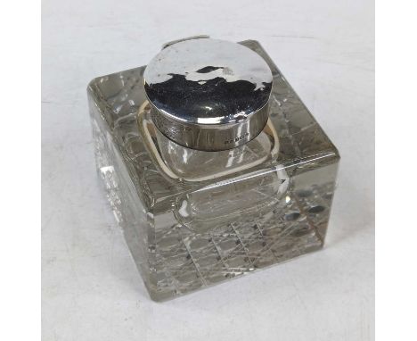 An Edwardian silver mounted cut glass inkwell, later engraved 'To Stafford Ransom from the staff of the British Press Ltd, Se