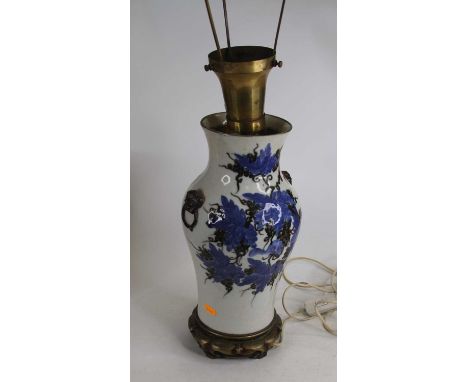 A Chinese blue &amp; black glazed porcelain table lamp, of baluster form, flanked by twin dog mask handles, height 35cm, excl