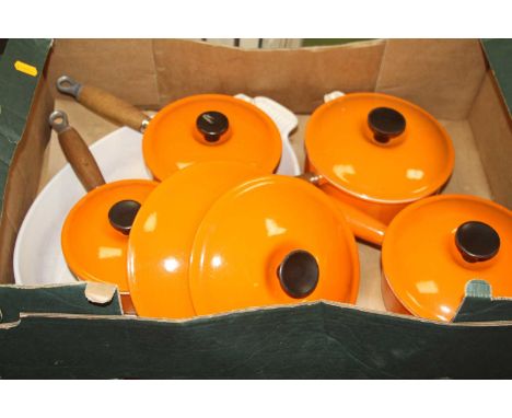 A collection of Le Creuset orange enamel cookwareSigns of heavy use, staining to all enamel.Pan 14 with lid heavily stained.P