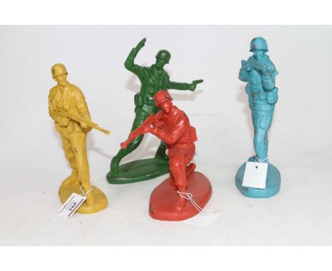 A set of four coloured resin models of army soldiers, largest height 19cm