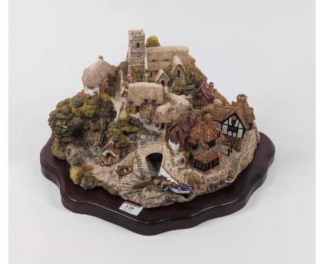 A Lilliput Lane resin model of St Peter's Cove, the base bearing note and signature of David Tate, founder &amp; sculptor of 