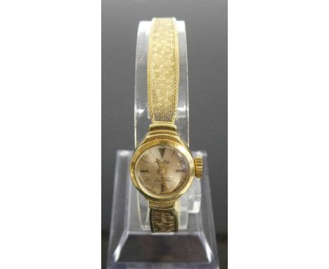 A lady's Arctos 14ct gold bracelet watch having manual wind movement and on mesh link bracelet with hinged deployment clasp, 