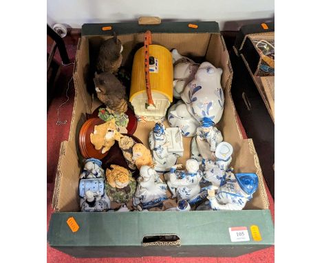 A collection of miscellaneous items to include porcelain figures, Regency Fine Arts animal figure groups, and novelty biscuit