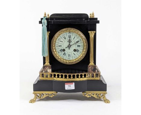 *A 19th century French black slate cased mantel clock of architectural form, the sectional white enamel dial with Roman numer