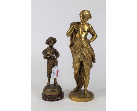 *A gilt painted spelter figure of a boy playing the bagpipes mounted to a circular rouge marble plinth, height 25cm, together