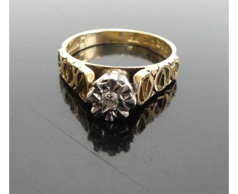 A modern lady's 9ct gold diamond solitaire ring, the small round brilliant in an illusion setting, with carved shoulders, 3g,