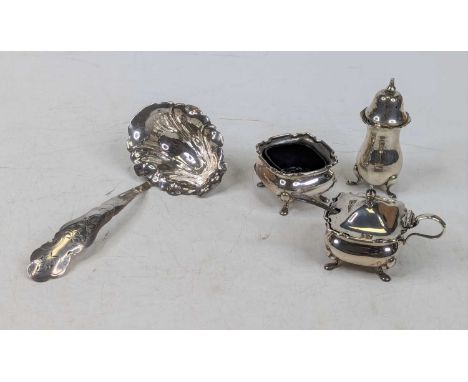 A George V silver part cruet set, comprising mustard with blue glass liner, and an open salt; together with an associated pep