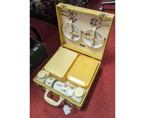 A Brexton mid-20th century picnic set, comprising four teacups and saucers, teaspoons, and various storage containers, within