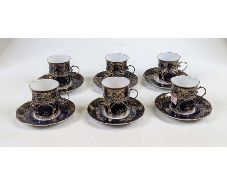 A set of six early 20th century Copeland Spode coffee cans and saucers each having gilt decoration on a dark blue ground, wit