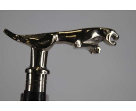 A walking stick having a reproduction Jaguar car mascot handle, height 90cm