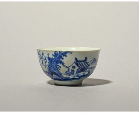 A rare Vauxhall blue and white teabowl, c.1755, painted in a strong blue with a Chinese figure fishing from a boat beside a h