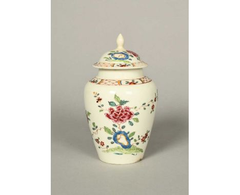 A rare and early Bow vase and cover, c.1750-52, the baluster form well painted with flowering peony branches issuing from blu