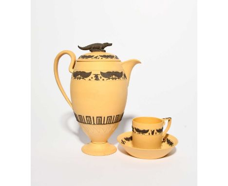 A Wedgwood caneware Egyptian Revival coffee pot and cover, early 19th century, applied in black with winged motifs and other 