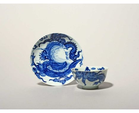 A rare Vauxhall blue and white teabowl and saucer, c.1755, painted with the Dragon pattern after a Chinese original, the larg