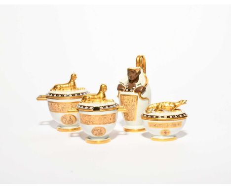 A Vienna Egyptian Revival part breakfast service, early 19th century, decorated with bands and panels of hieroglyphs on a buf