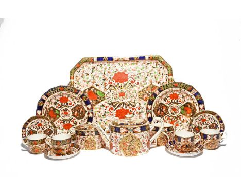 A Royal Crown Derby cabaret tea service, c.1880, richly decorated in the Imari palette in pattern 198 with birds perched amon