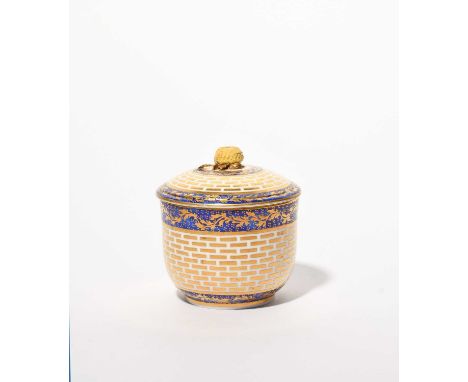 A Sèvres sucrier and cover, c.1770, decorated with a pattern of gold brickwork (briques d'or), the rims with a continuous gil