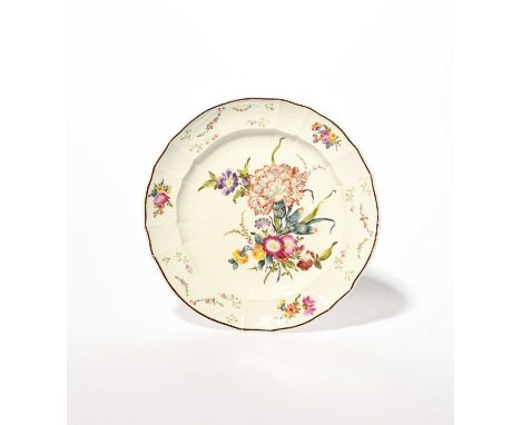 An early Furstenberg plate, c.1765, painted to the well with a large arrangement of flowers including a carnation and auricul