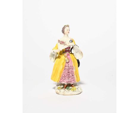 A rare Bow figure of a lady, c.1758, after a Meissen model by Peter Reinicke, wearing a layered crinoline dress with a gilt l