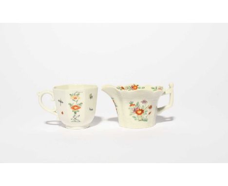 An early Worcester creamer and an octagonal cup, c.1753-55, the creamer moulded and painted in the Kakiemon manner with panel