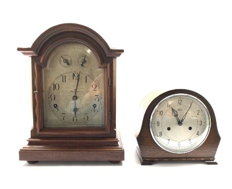 German walnut cased mantel clock by Kienzle, silvered dial with Arabic chapter ring, Westminster chiming movement with silent