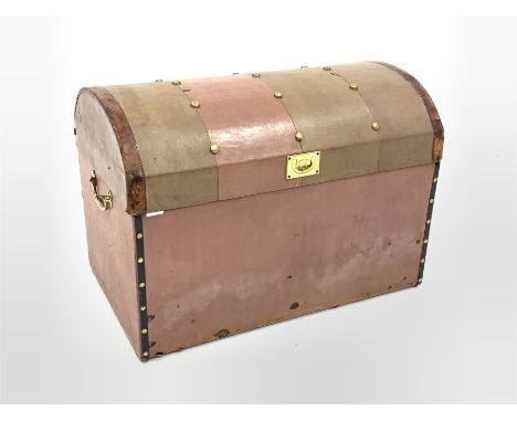 Early 20th century dome top trunk, with studded top, covered and bound in leather, interior lined with striped blue fabric, t