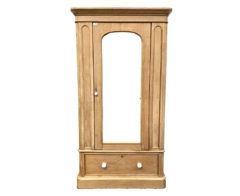 Victorian pine single wardrobe, mirrored door enclosing interior fitted for hanging, over one drawer with white ceramic pull 