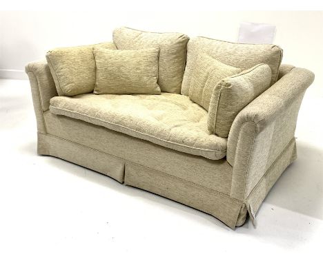 Two seat sofa upholstered in beige fabric, loose cushions, raised on castors, W147cm - Condition Report 