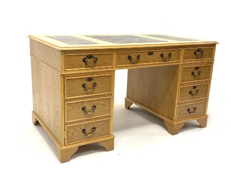 LE-AL Furniture of Manchester 20th century light oak twin pedestal desk with triple inset leather top, fitted with six drawer