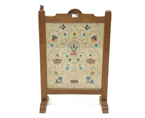 'Squirrelman' Yorkshire oak fire screen, adzed frame enclosing glazed needlework panel, raised on arched sledge supports, 50c