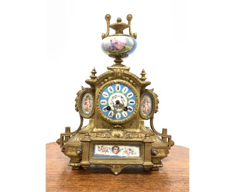 19th century French brass mantel clock with Sevres porcelain panels, surmounted by urn finial, eight day twin train movement 