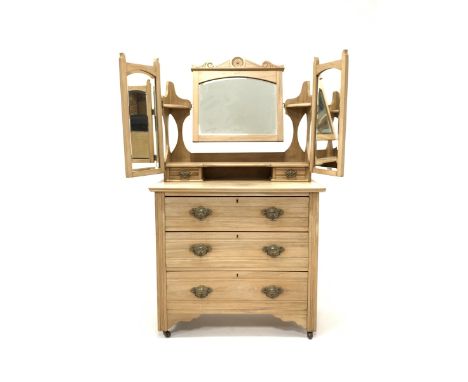 Edwardian satin walnut dressing chest, the top section fitted with three swing mirrors and two trinket drawers, three drawers