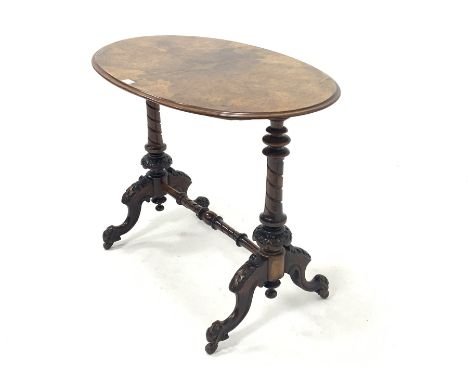 Victorian figured walnut oval stretcher table, quarter sawn veneered top over spiral turned uprights and leaf carved splayed 