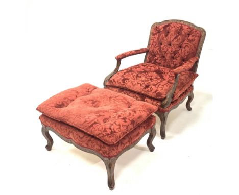 French style figured walnut open armchair, with swept arms and serpentine terminals, upholstered in floral claret red damask 