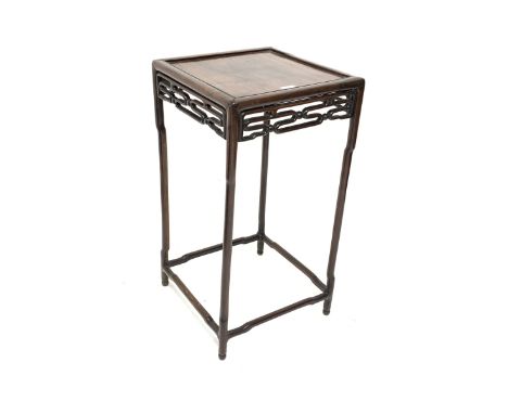 19th century Chinese hardwood lamp table, with panelled top, pierced carved frieze, raised on slender shaped supports united 