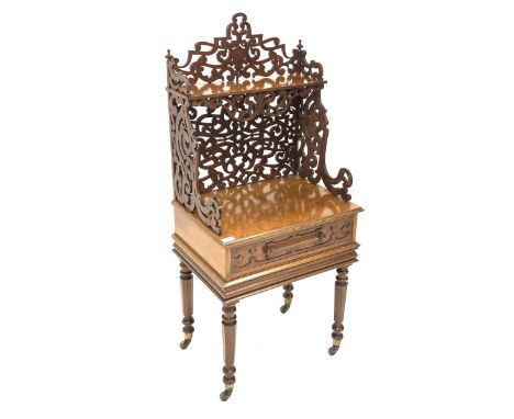 Victorian oak etagere, open shelf raised on scrolled and floral fretwork, over single drawer with blind fretwork embellishmen