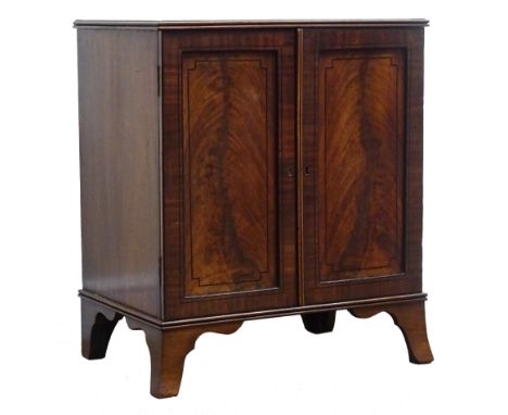 Regency ebony strung mahogany medal or coin collectors cabinet, with reeded top, two panel doors enclosing eleven drawers, sh