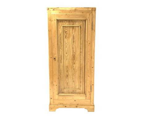 Large pine cupboard, with single fielded panelled door enclosing a shelf, raised on bracket supports, W90cm, H205cm, D48cm - 