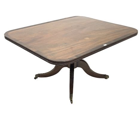 George III mahogany tilt top supper table, rosewood cross banded top over turned and gadroon carved pillar and four leaf carv